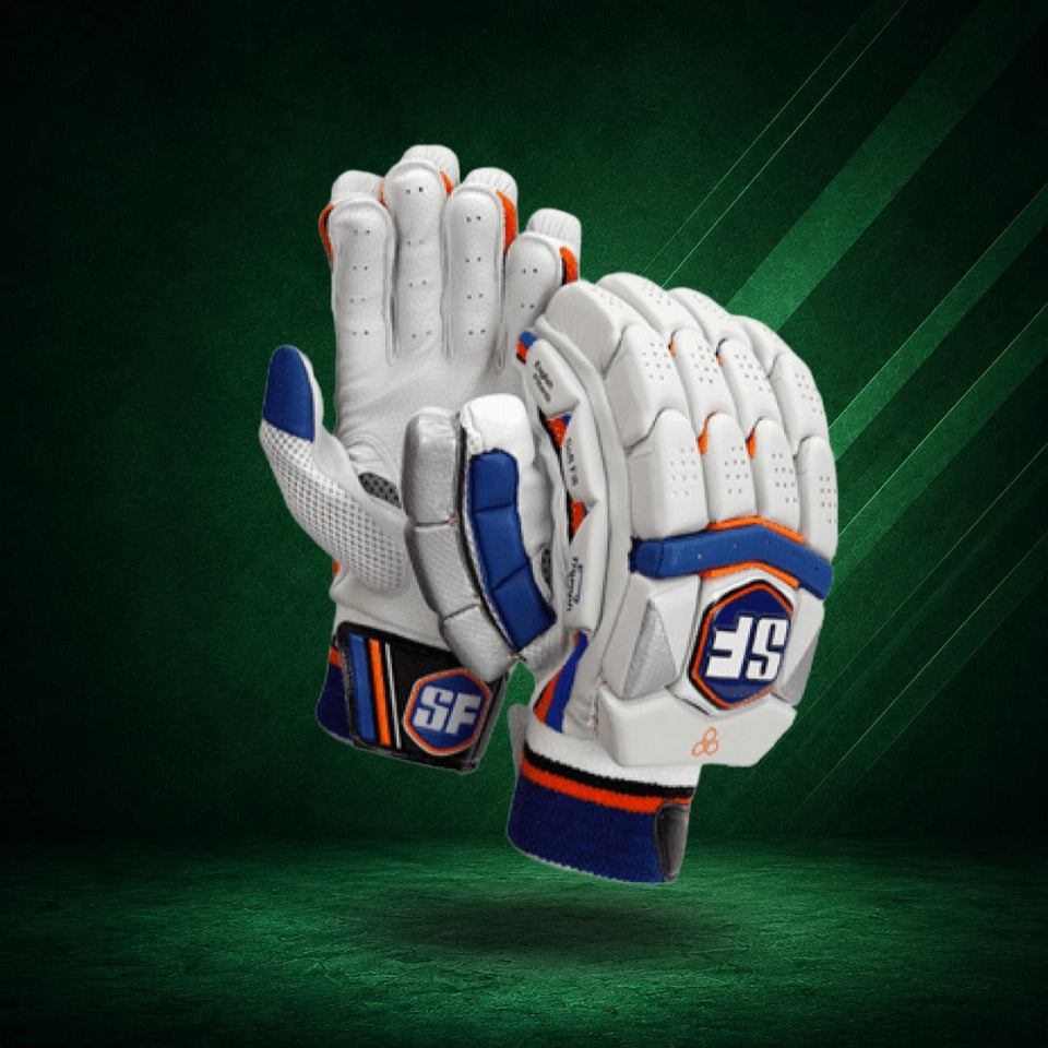 A pair of white cricket gloves with blue and orange accents, featuring the 'SF' logo, set against a dark brown background with a warm orange glow.